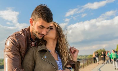 Woman kissing confident man