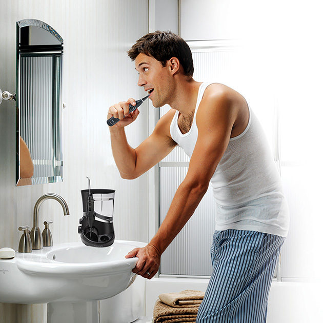 Man Using Waterpik