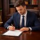 Man Signing Prenuptial Agreement