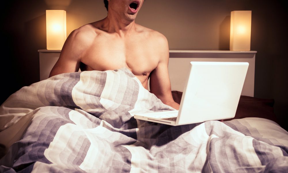 Guy In Bed Watching Porn