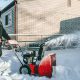 Man using snow blower