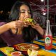Woman eating tacos