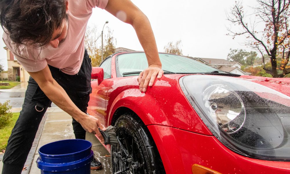 Guy washing his car