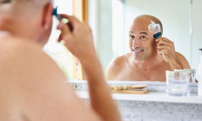 Man shaving his head
