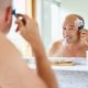 Man shaving his head