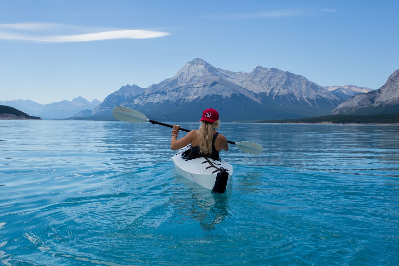 Girl kayaking on a lake