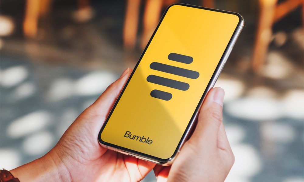 Woman using Bumble on phone